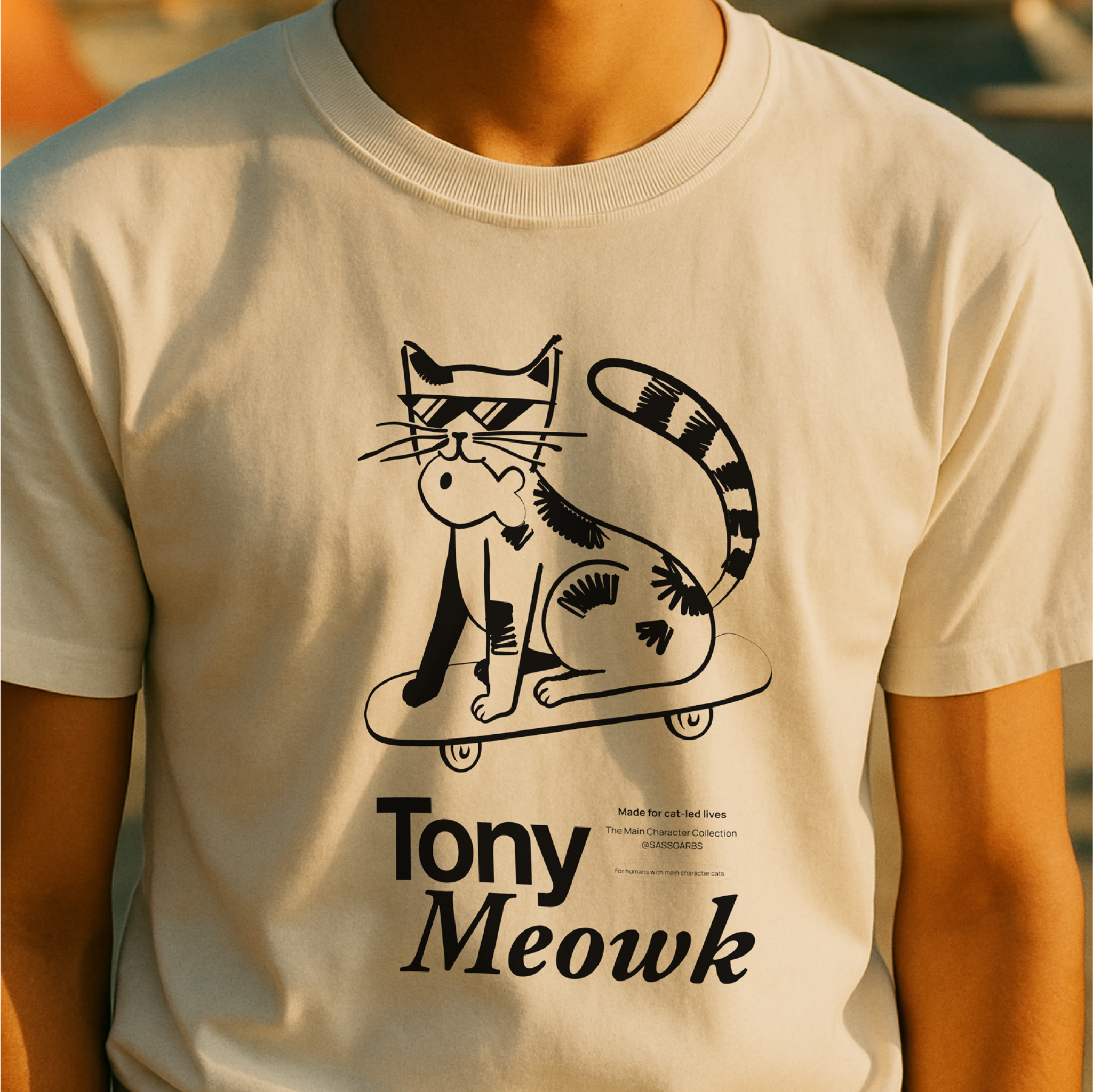 White t-shirt with a black cat graphic and 'Tony Meowk' text, worn by a person.